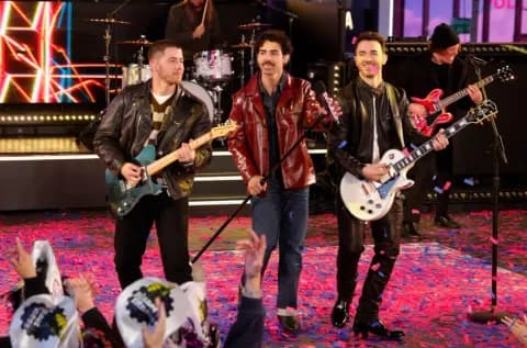 The Jonas Brothers perform during Times Square New Year's Eve 2025 Celebration on December 31, 2024 in New York City. 